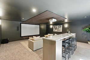 Home theater room featuring light carpet and recessed lighting