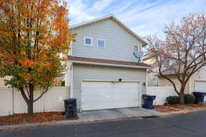 View of side of property with an attached garage