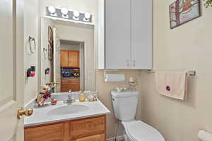Bathroom featuring vanity and toilet