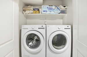 Washroom featuring washer and clothes dryer