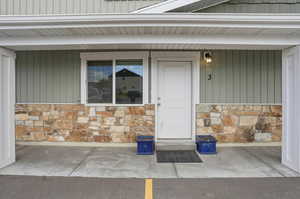 Property entrance with stone siding