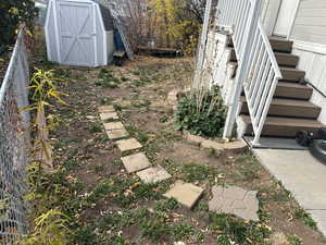 View of yard with a storage unit