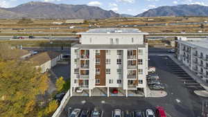 Bird's eye view of a mountain backdrop and apartment complex / building