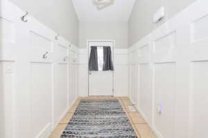 Mudroom featuring light tile patterned floors