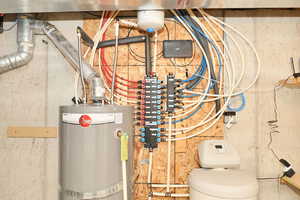 Utility room featuring gas water heater