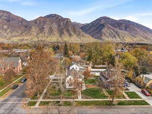 View of mountain backdrop featuring nearby suburban area