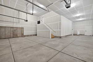 Garage featuring a garage door opener