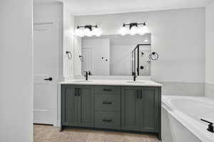 Full bath featuring double vanity, a bath, a shower stall, and light tile patterned floors
