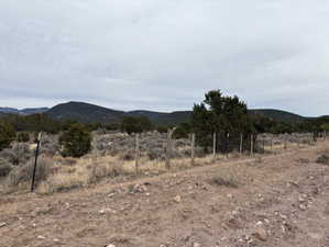View of mountain background featuring rural landscape