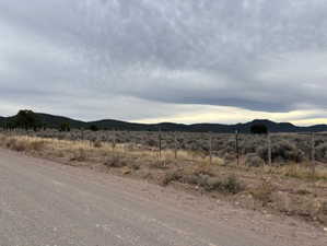 View of mountain backdrop featuring rural landscape