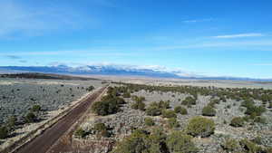 Aerial view of sparsely populated area featuring mountains and a desert landscape