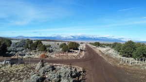 View of mountain backdrop with rural landscape