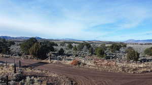 View of mountain background featuring rural landscape