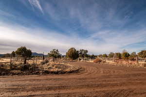 View of dirt / gravel road with a view of countryside
