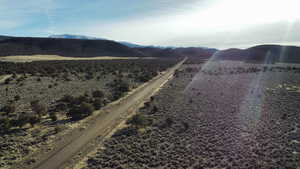 View of mountain backdrop with rural landscape