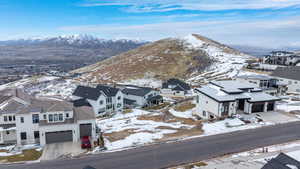 Aerial perspective of suburban area with a mountain backdrop