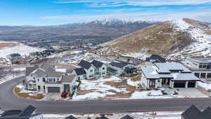 Aerial perspective of suburban area featuring a mountain backdrop