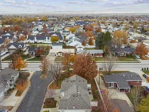 Aerial perspective of suburban area featuring a mountainous background