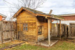 View of outbuilding with a fenced backyard