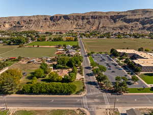 Aerial view of property's location with a mountainous background and rural landscape