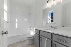Bathroom featuring bathtub / shower combination and vanity