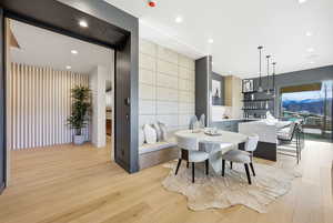 Dining area featuring light wood-style flooring and recessed lighting