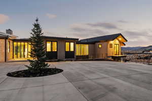 View of back of house at dusk