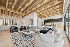 Lobby with a high ceiling and a wooden ceiling with exposed beams
