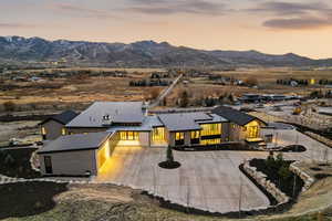 Aerial view of property and surrounding area with mountains