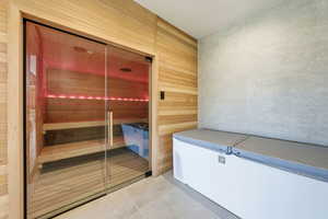 Relaxing sauna with tile patterned floors and wood walls