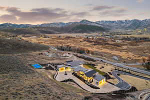 Aerial view at dusk of a mountain view and a view of countryside