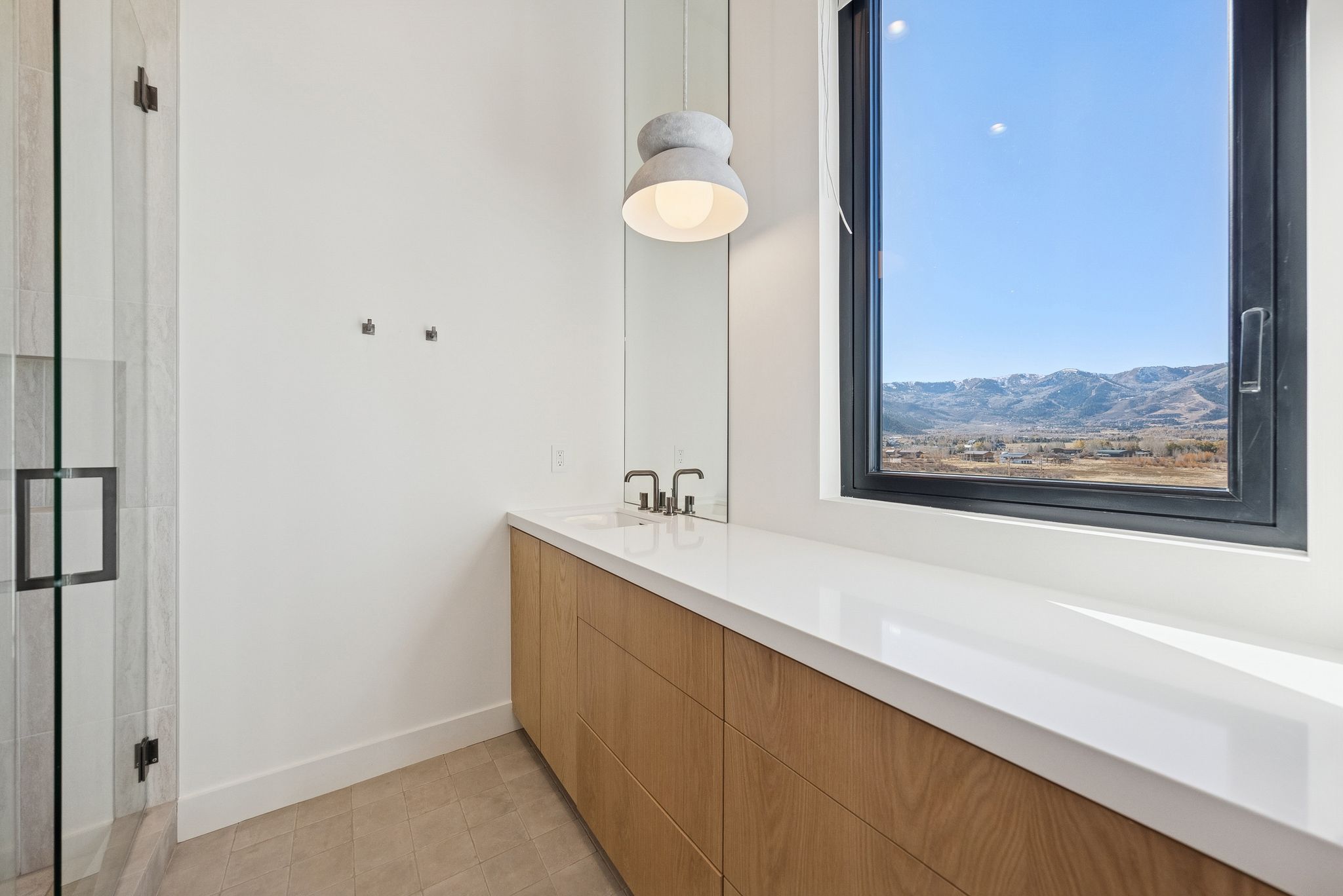 Bathroom featuring vanity and a stall shower