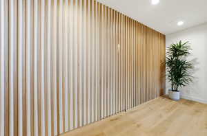 Spare room featuring wood finished floors and recessed lighting