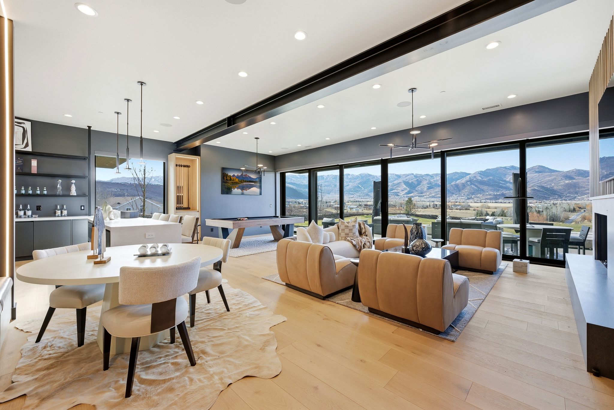 Dining space with a mountain view, light wood-style floors, recessed lighting, plenty of natural light, and pool table