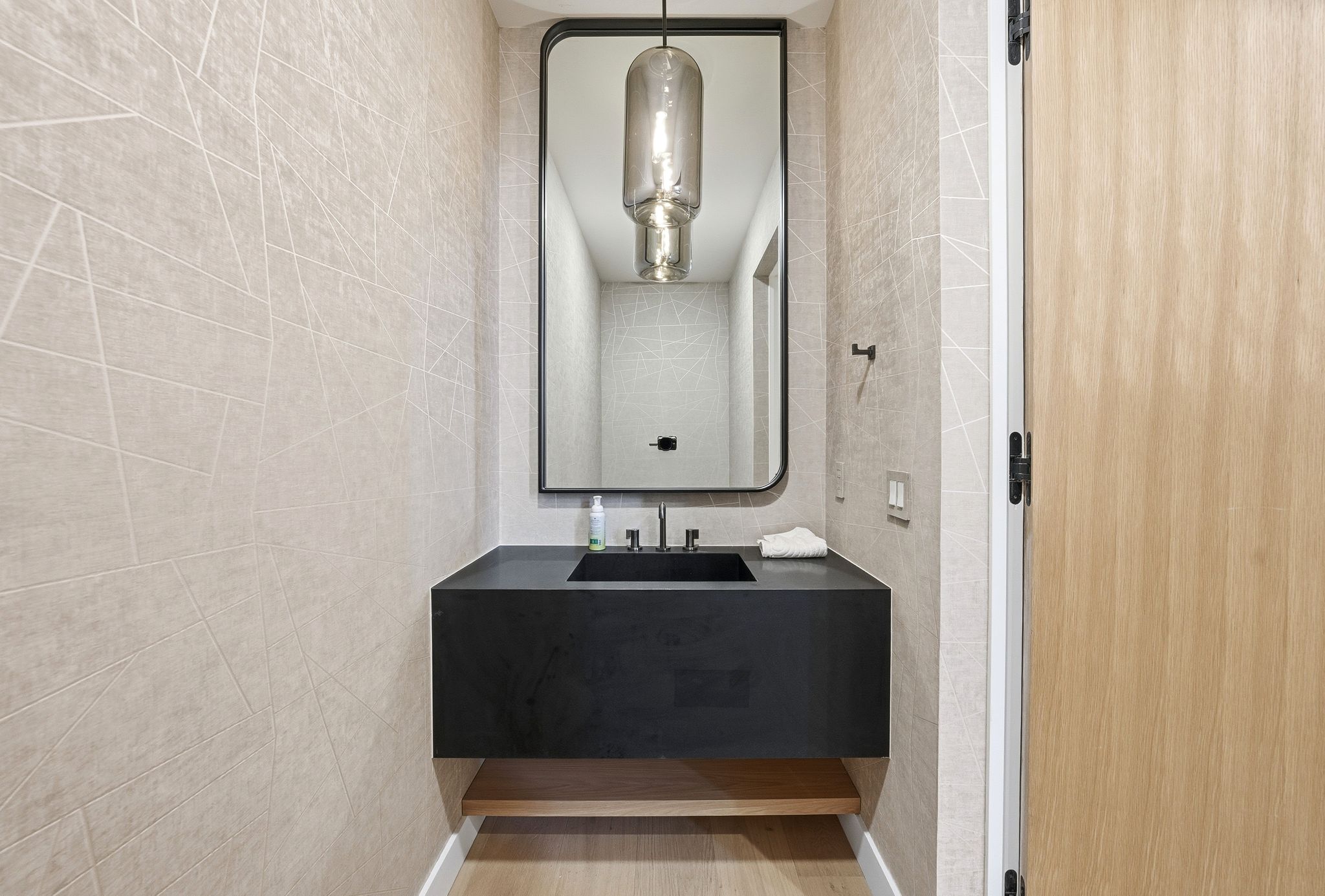 Half bathroom with tile walls and vanity