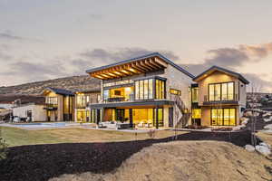 Rear view of house with a balcony, stairway, a patio area, an outdoor living space, and an outdoor pool