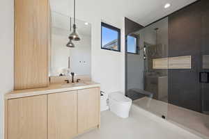 Full bathroom with a stall shower, vanity, recessed lighting, and light floors