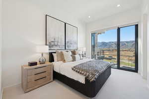 Bedroom with access to exterior, light carpet, a mountain view, and recessed lighting