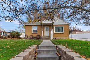 Bungalow-style house with brick siding
