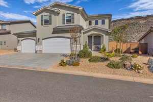 Mediterranean / spanish-style house featuring driveway, a tile roof, stucco siding, and a garage