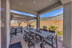 Fenced backyard with an outdoor living space, a patio, and outdoor dining space