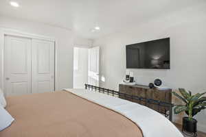 Bedroom featuring a closet and recessed lighting