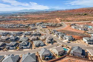 Aerial perspective of suburban area featuring a mountain backdrop