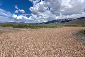 View of mountain background featuring rural landscape