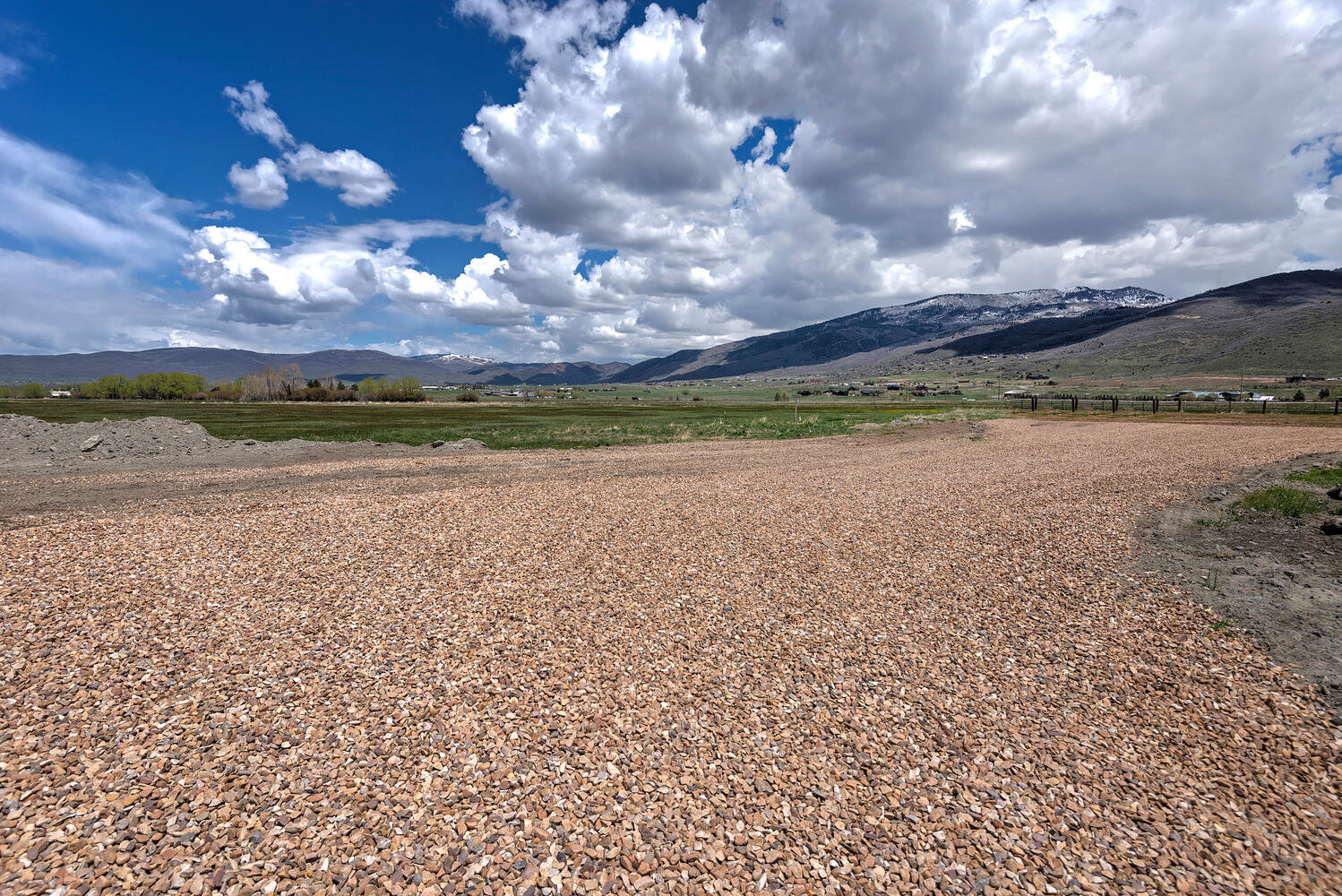 View of mountain backdrop with rural landscape