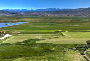 View of community featuring a water and mountain view