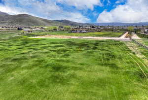 View of mountain background featuring rural landscape and agricultural land
