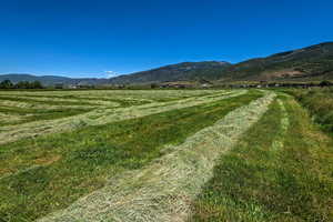 View of mountain background featuring rural landscape