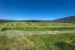 View of mountain background featuring rural landscape