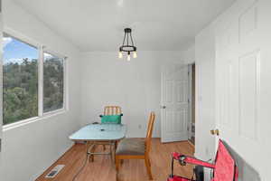 Dining room with light wood-style floors and baseboards